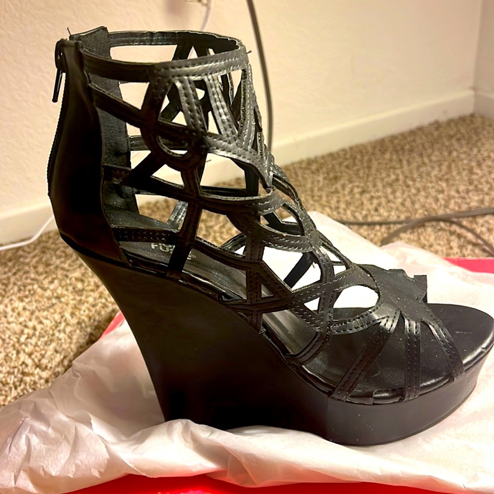 Black wedge heels with zipper.